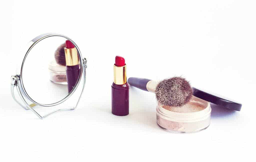 Set your lipstick with a tissue and loose powder